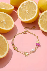 Bedelarmband met hart, bloem, parel en kraaltjes